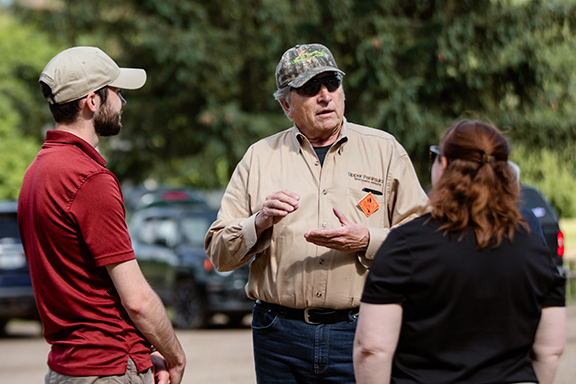 Straits Area Sportsmen's Club President Gary Gorniak talks to representatives from Michigan United Conservation Clubs and the Congressional Sportsmen's Foundation.